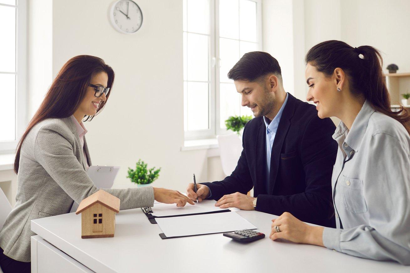 Satisfied Millennial Couple Clients Signing Real Estate Contract Agreement